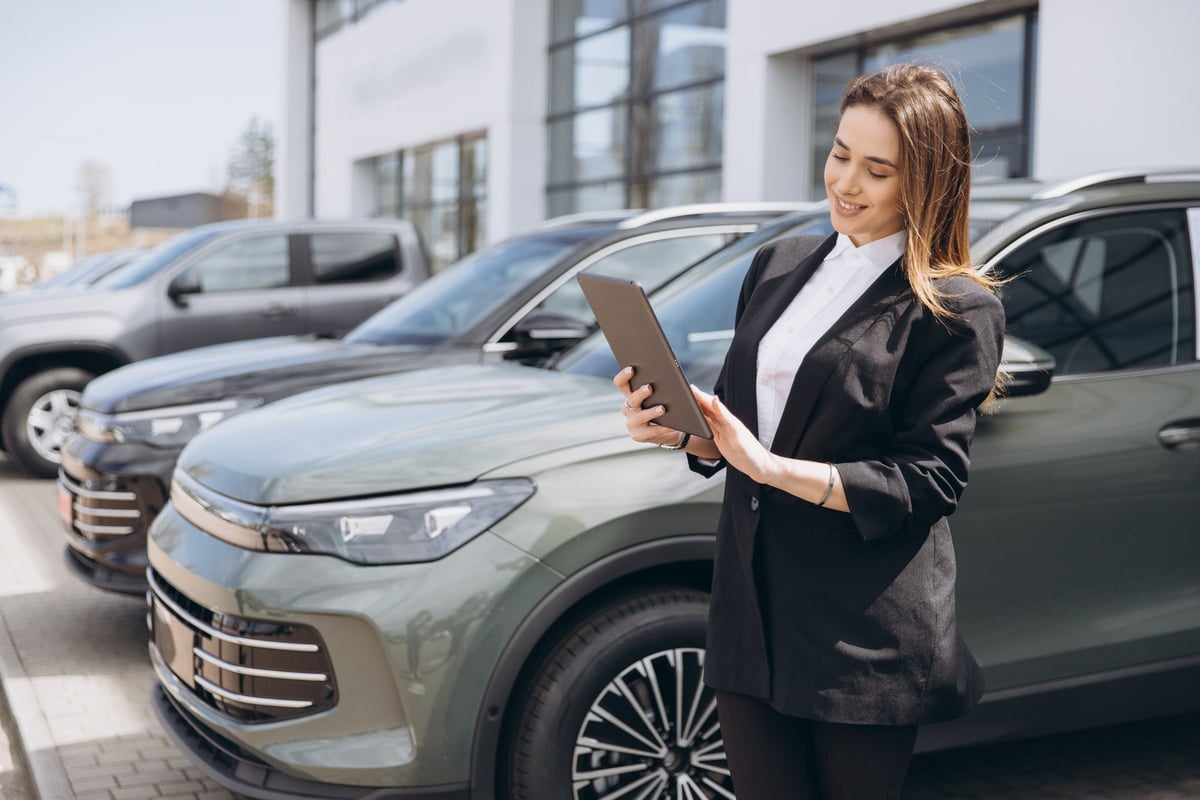 Saleswoman at a car dealership