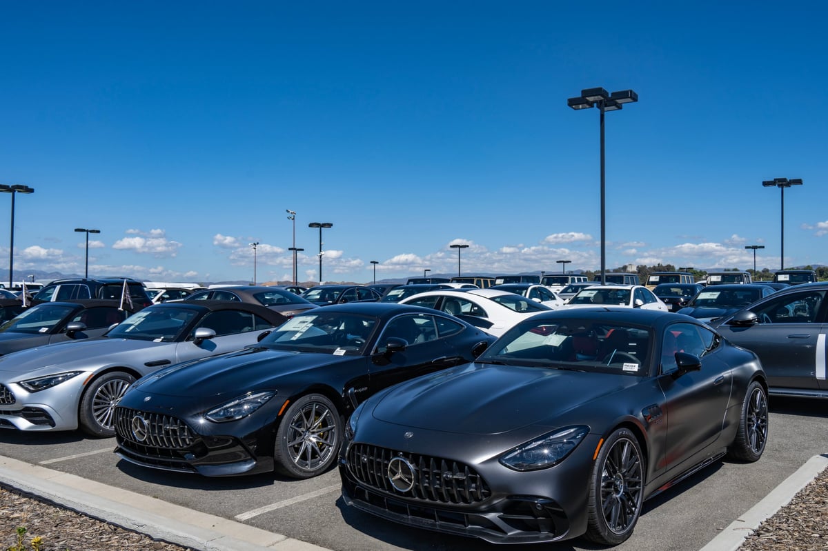 New cars lined up at a modern car dealership