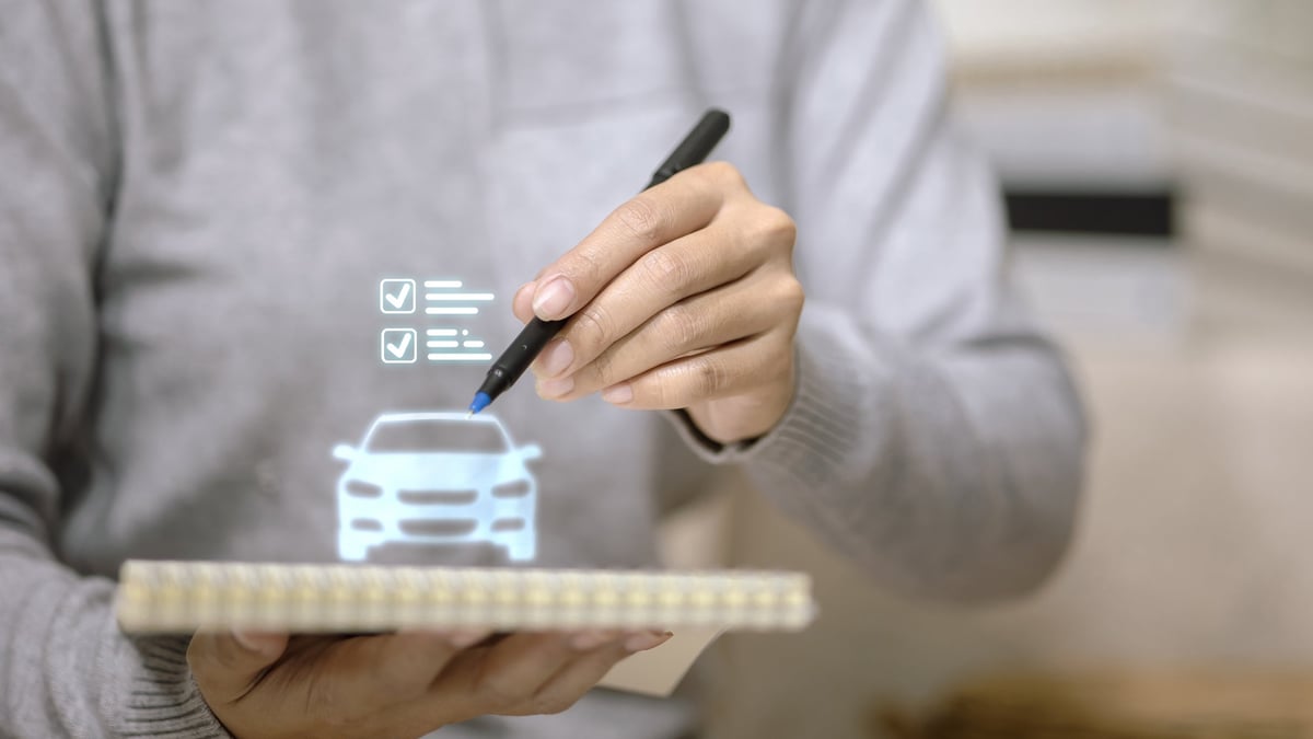 Salesperson using a digital checklist on a tablet